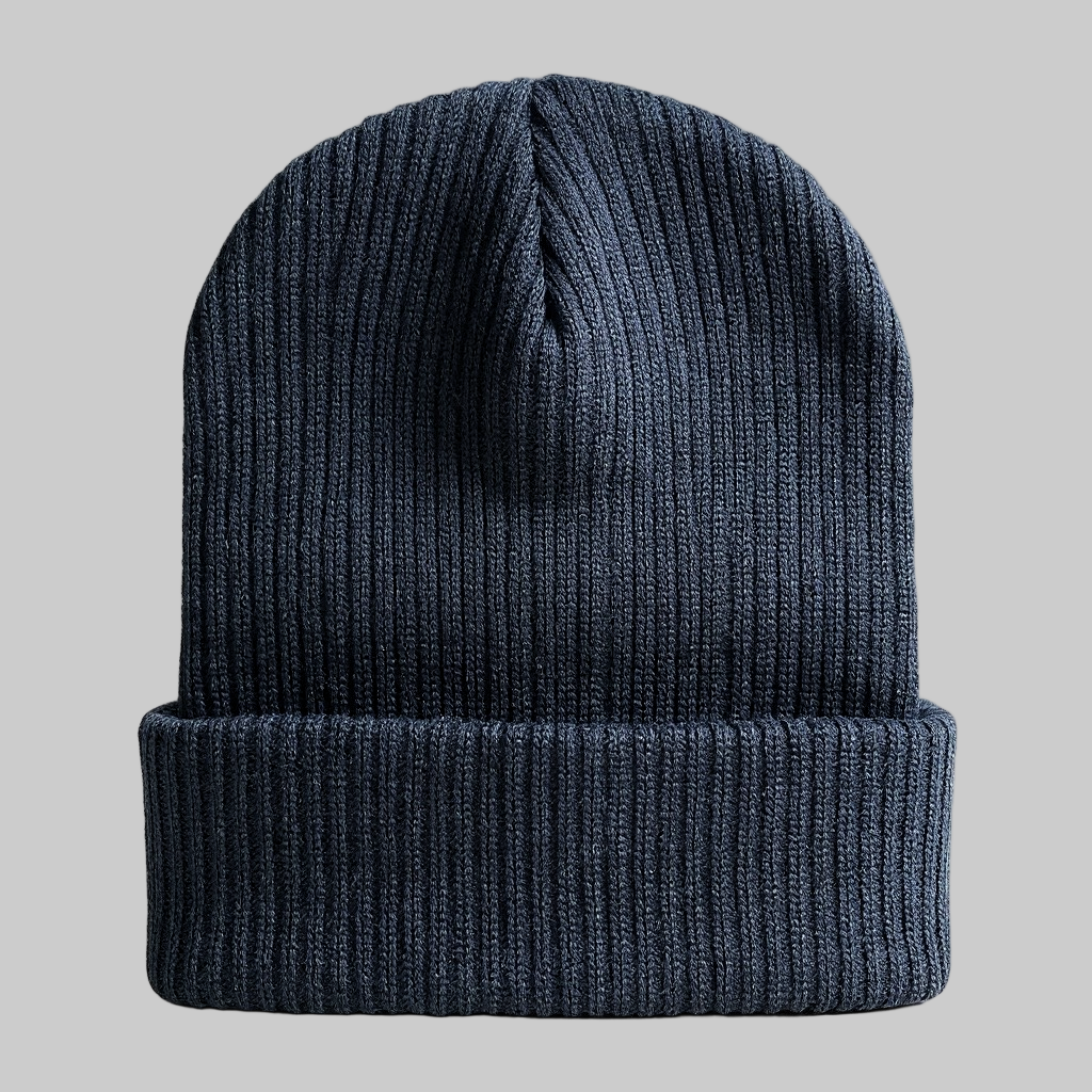 Black knit beanie on a light gray background