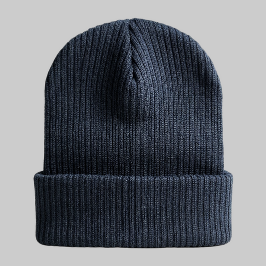 Black knit beanie on a light gray background
